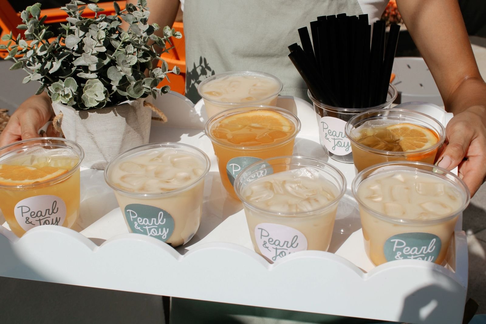 Pearl & Joy boba catering bar set up at a Los Angeles area event venue with tea dispensers, cups, and toppings