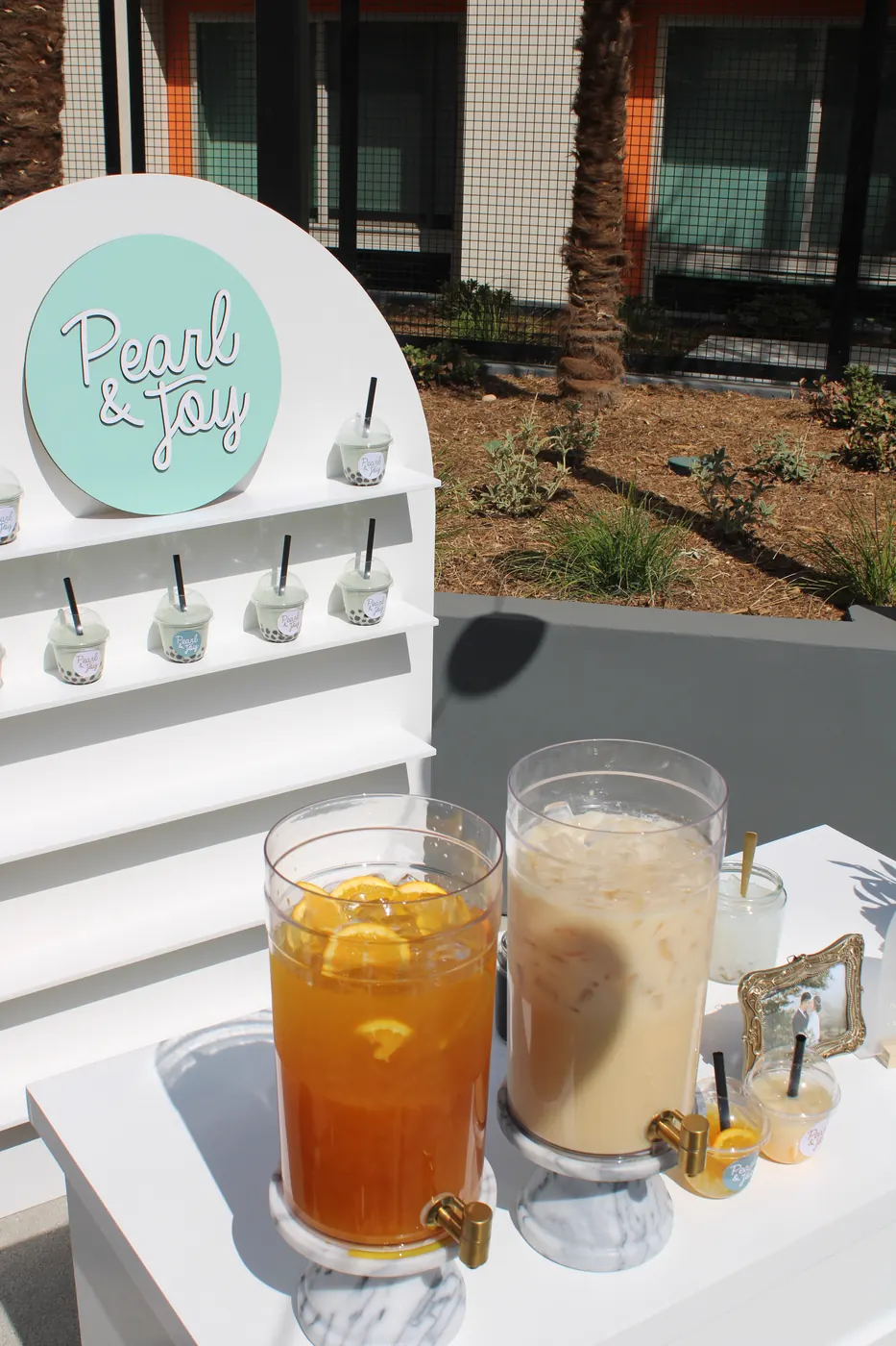 Pearl & Joy wedding boba display with signature drinks and branded cups